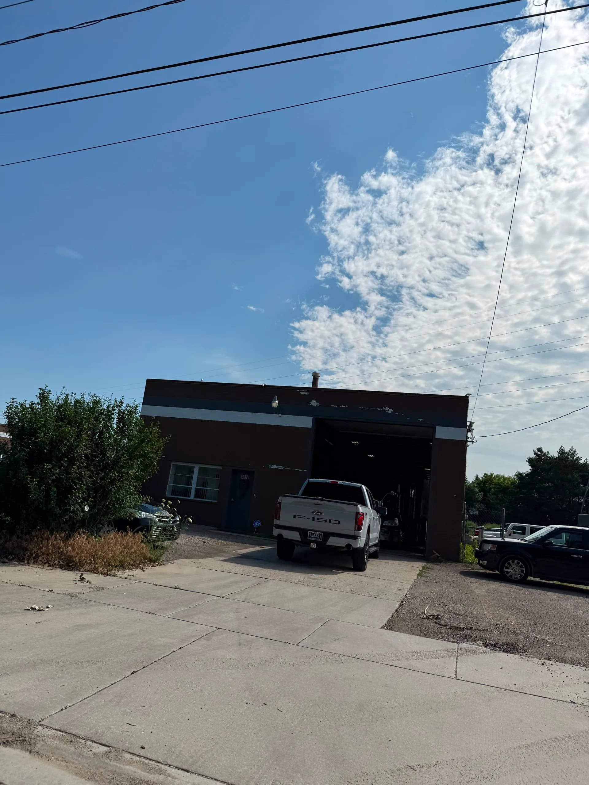 Exterior of 2070 Depot St, a shop with a drive-in bay