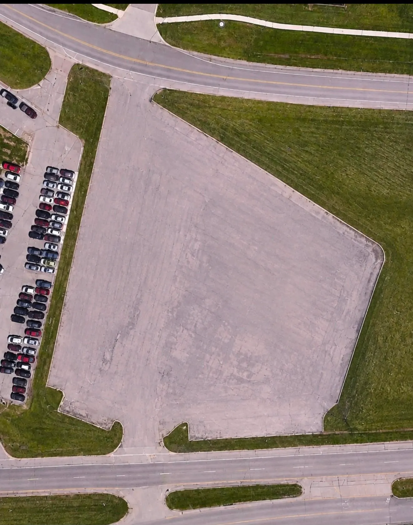 Aerial view of the paved corner lot at 6951 Lansing Rd in Charlotte